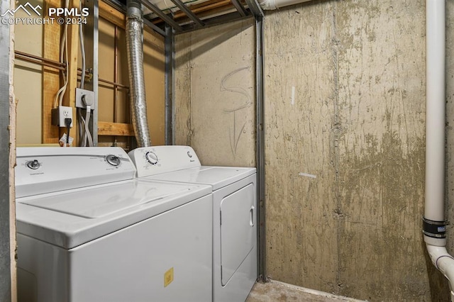 laundry area with washing machine and dryer