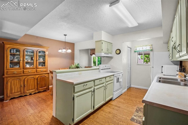 kitchen featuring sink, light hardwood / wood-style flooring, an inviting chandelier, white appliances, and green cabinets