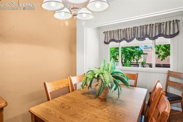 dining space featuring an inviting chandelier