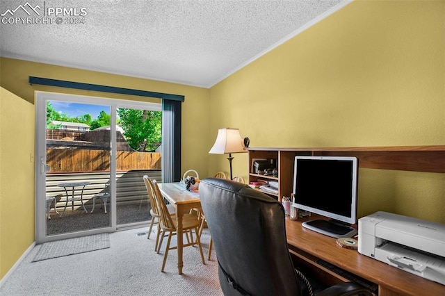 office area with vaulted ceiling, a textured ceiling, and carpet flooring