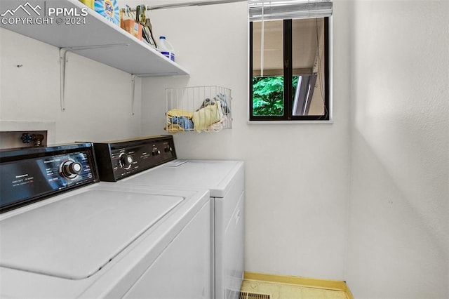 laundry room with washing machine and dryer