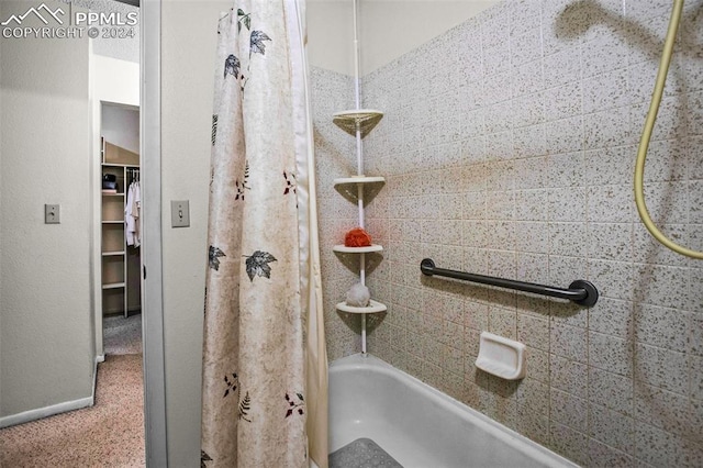 bathroom featuring shower / bath combination with curtain