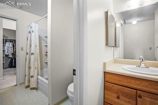 full bathroom with vanity, tile patterned floors, toilet, and shower / tub combo with curtain