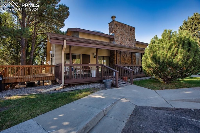 view of front of house with a wooden deck