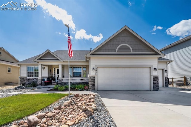 craftsman house with a garage and a porch