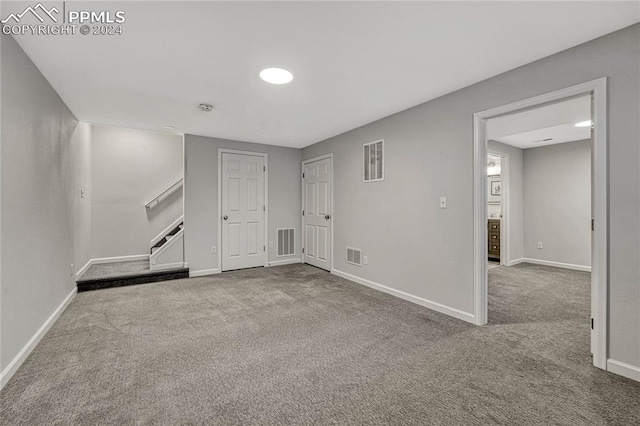 unfurnished living room featuring carpet flooring