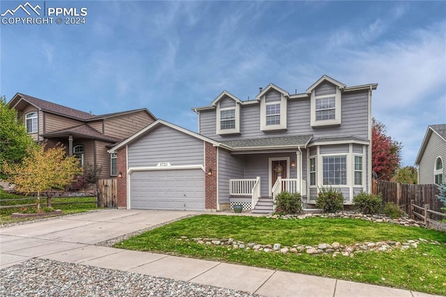 front facade featuring a front yard and a garage