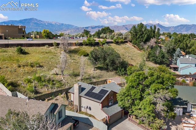 birds eye view of property featuring a mountain view