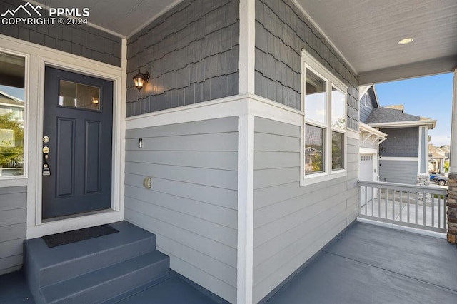 property entrance featuring a porch