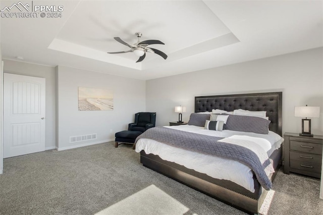 8032 Wheatland Dr, Colorado Springs, CO 80908 - bedroom featuring a tray ceiling, baseboards, carpet, and visible vents