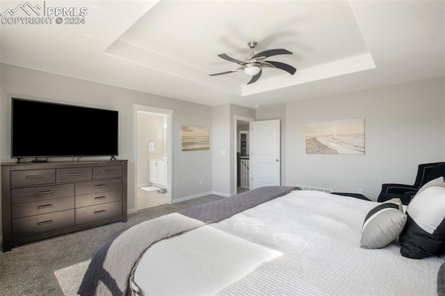 8032 Wheatland Dr, Colorado Springs, CO 80908 - bedroom with baseboards, ensuite bath, a tray ceiling, ceiling fan, and carpet