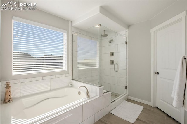 8032 Wheatland Dr, Colorado Springs, CO 80908 - bathroom featuring a shower stall, tile patterned floors, baseboards, and a garden tub
