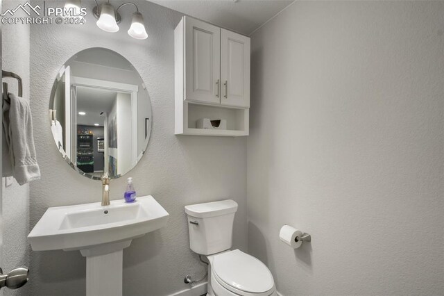 8032 Wheatland Dr, Colorado Springs, CO 80908 - half bathroom with toilet