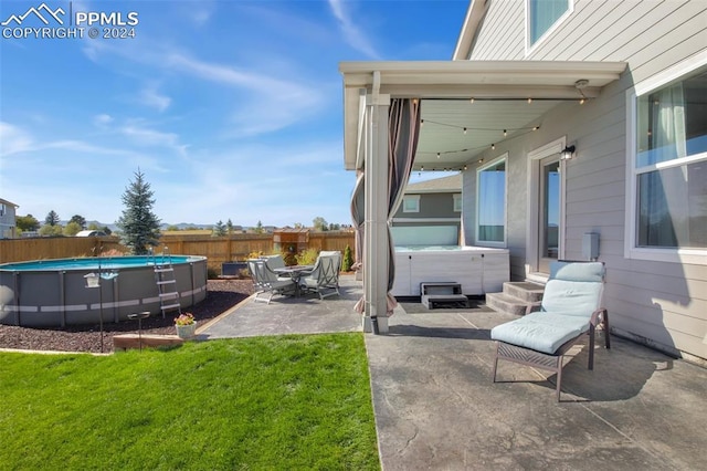 8032 Wheatland Dr, Colorado Springs, CO 80908 - view of yard featuring a fenced in pool, a patio area, fence, and a hot tub