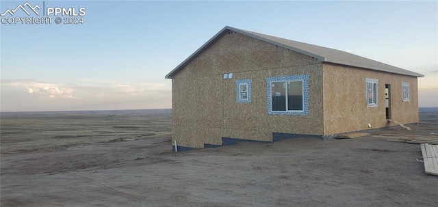 view of property exterior at dusk