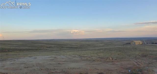 property view of mountains featuring a rural view