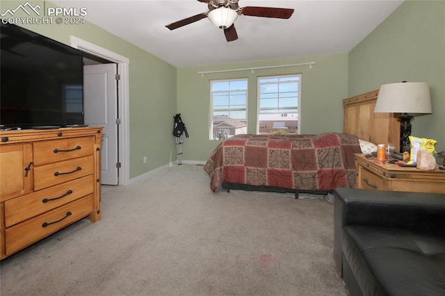 bedroom with light carpet and ceiling fan