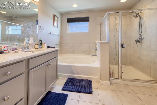 bathroom with vanity, plus walk in shower, and tile patterned floors