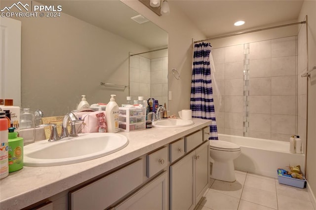 full bathroom with vanity, tile patterned flooring, toilet, and shower / tub combo