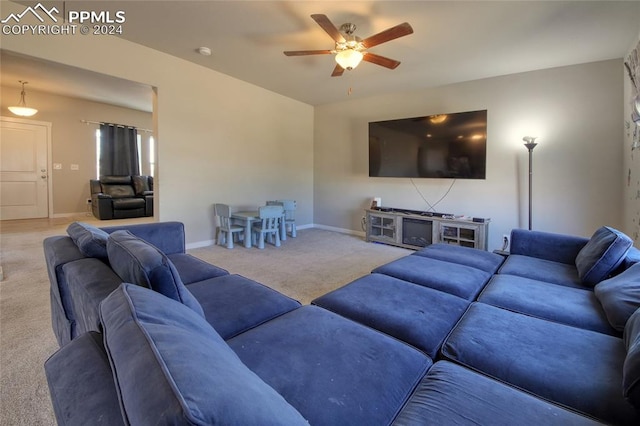 living room with light carpet and ceiling fan