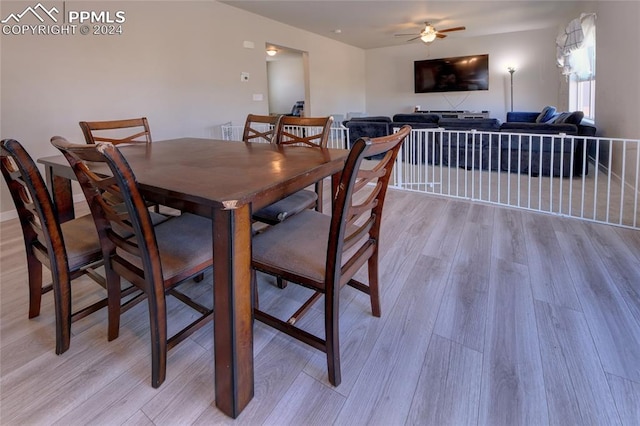 dining room featuring light hardwood / wood-style floors and ceiling fan