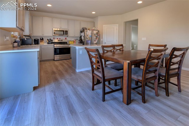 dining area with light hardwood / wood-style flooring