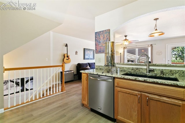 kitchen with dishwasher, light stone counters, sink, light hardwood / wood-style flooring, and ceiling fan