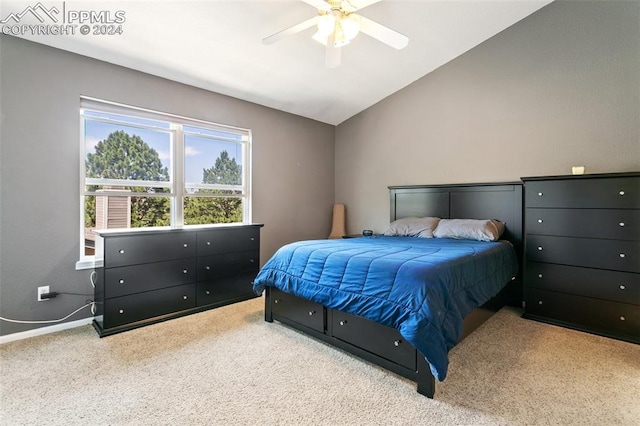 bedroom with carpet flooring, vaulted ceiling, and ceiling fan