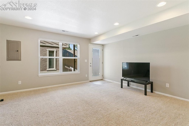 interior space with electric panel and light carpet