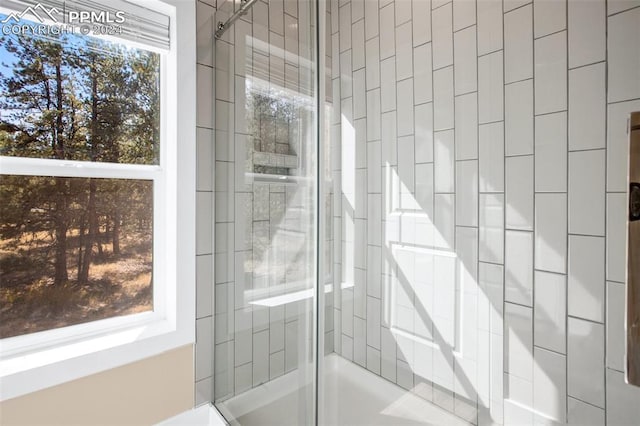 bathroom with an enclosed shower