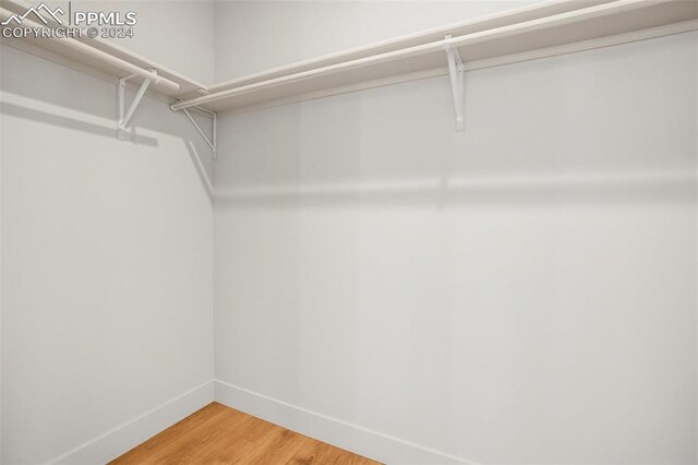 walk in closet featuring hardwood / wood-style floors