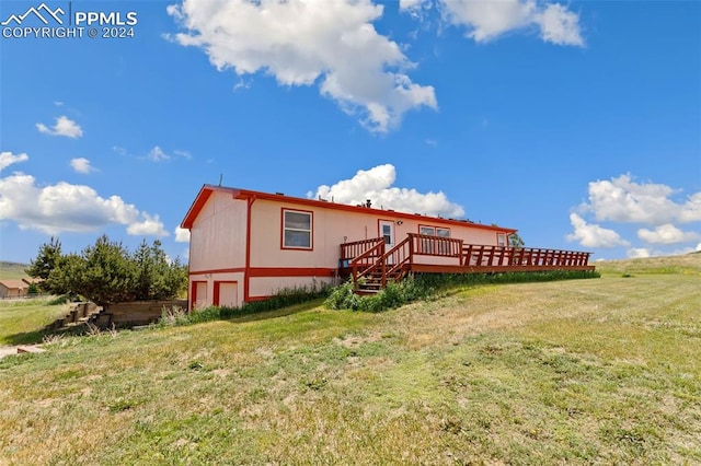 exterior space with a lawn and a deck