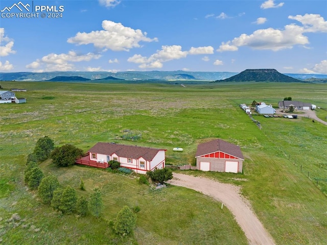 bird's eye view featuring a mountain view and a rural view