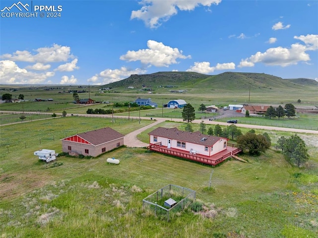 bird's eye view featuring a mountain view and a rural view