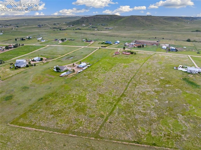 bird's eye view with a mountain view and a rural view