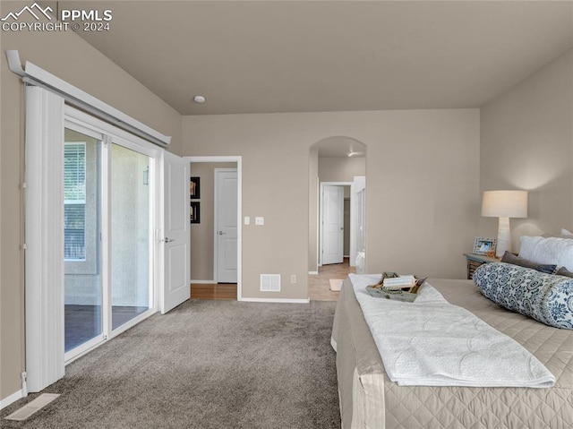 bedroom featuring access to exterior and carpet flooring