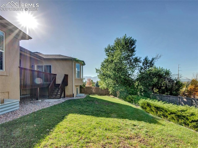 view of yard featuring a wooden deck