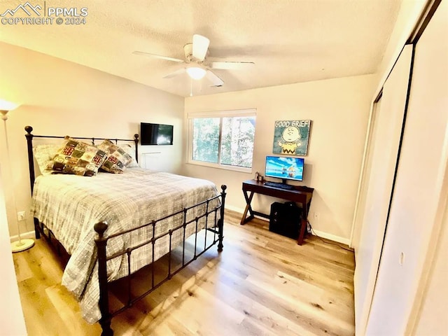 bedroom featuring wood-type flooring and ceiling fan