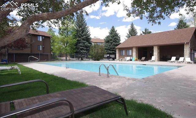 view of swimming pool with a patio area