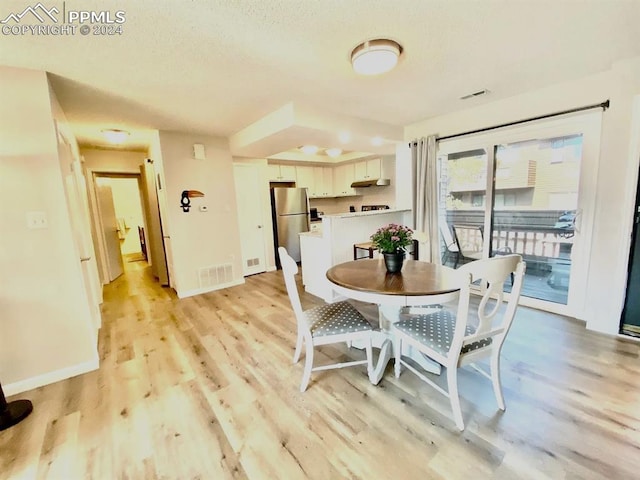 dining room featuring light hardwood / wood-style floors