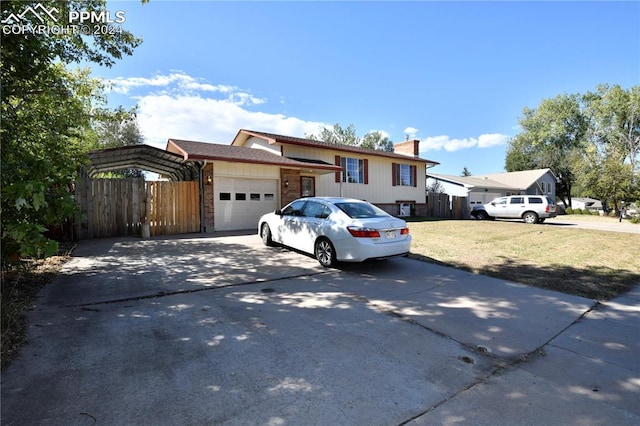 view of front of home featuring a front yard and a garage