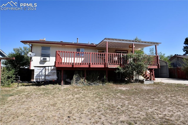 back of property featuring a wooden deck and cooling unit