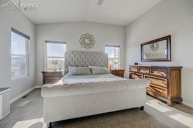 bedroom with light carpet, lofted ceiling, and multiple windows