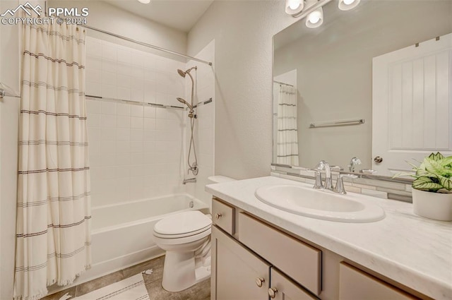 full bathroom featuring shower / tub combo, vanity, and toilet