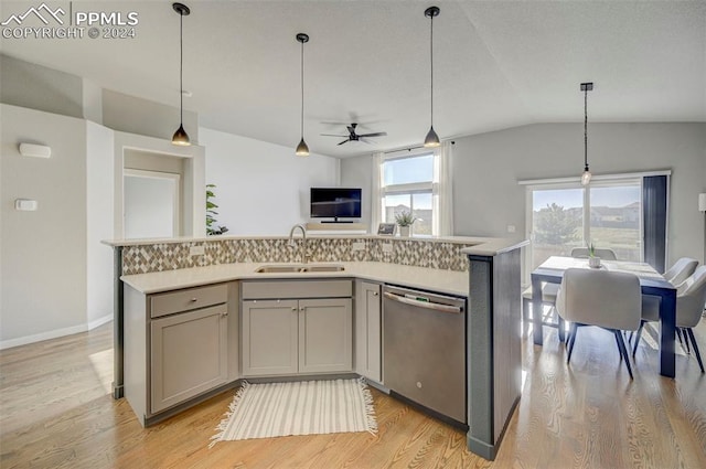 kitchen featuring gray cabinets, light wood-type flooring, sink, vaulted ceiling, and stainless steel dishwasher