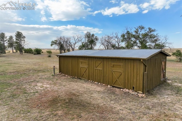 view of outbuilding featuring a rural view