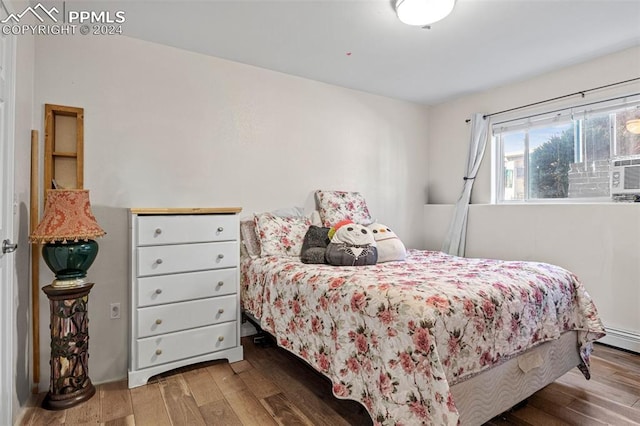 bedroom with hardwood / wood-style flooring