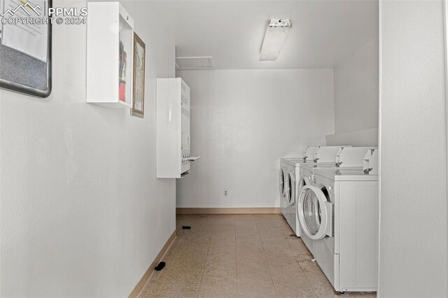 clothes washing area featuring washing machine and dryer