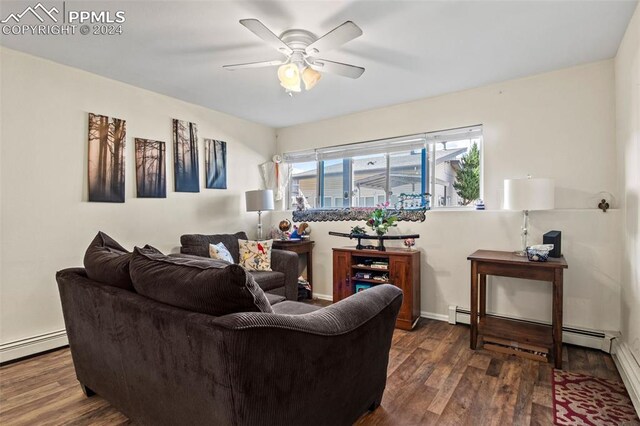 living room featuring a baseboard radiator, ceiling fan, and dark hardwood / wood-style floors