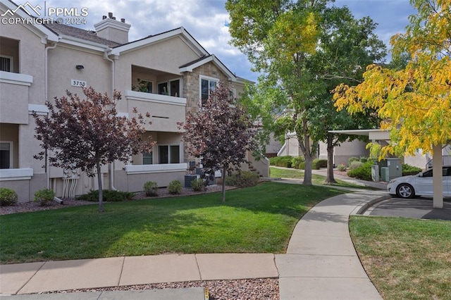 view of home's community featuring a lawn